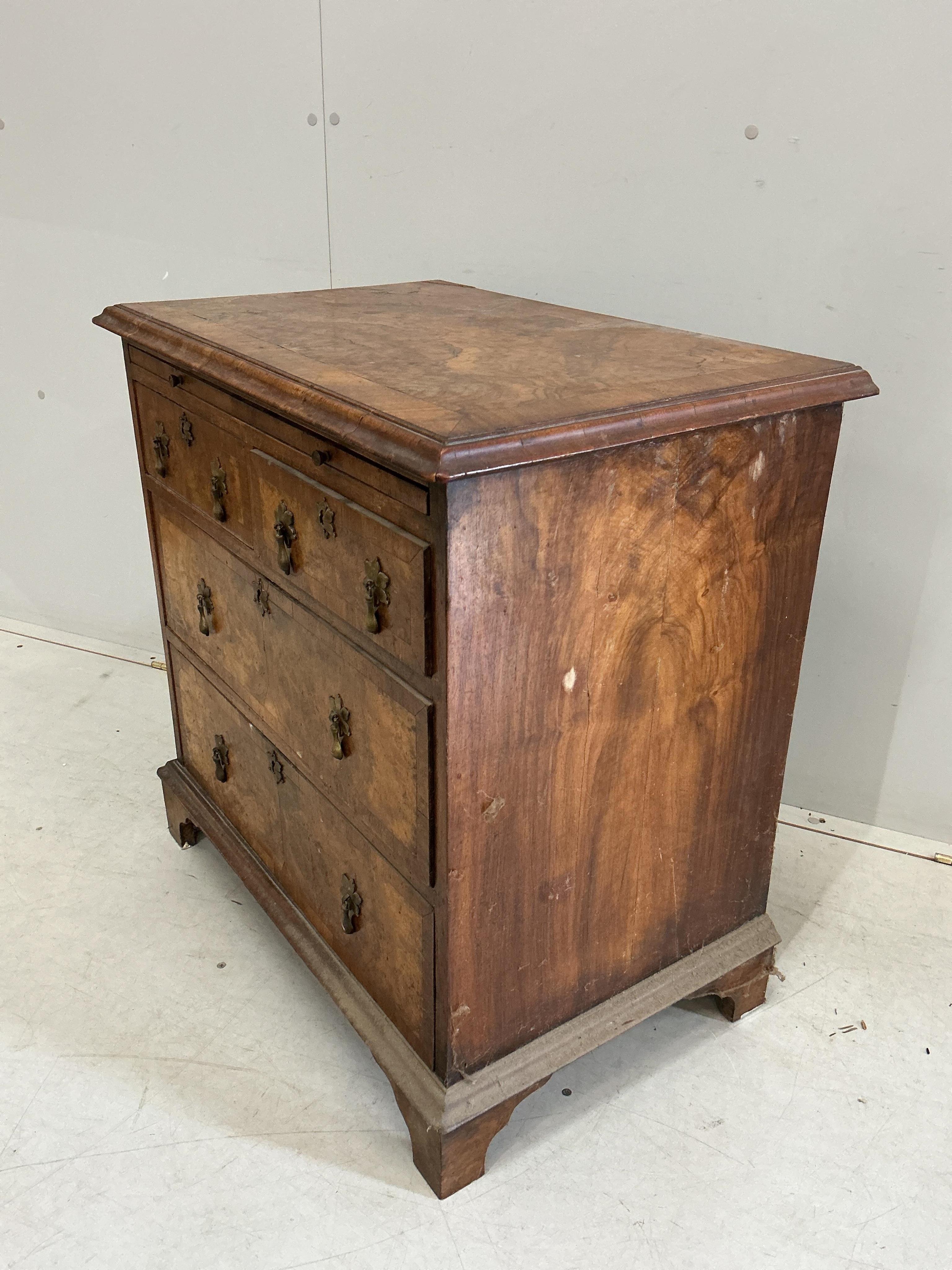 A small Queen Anne Revival crossbanded walnut bachelor’s chest with slide, width 71cm, depth 45cm, height 72cm